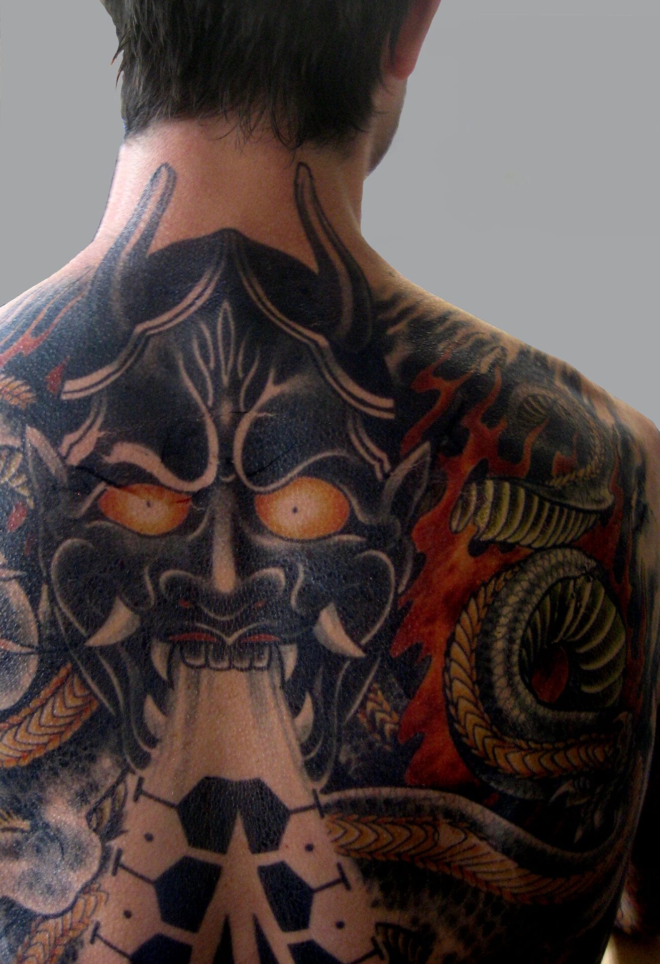 Watch UFC Fighter Derrick Lewis Breaks Down His Tattoos | Tattoo Tour | GQ